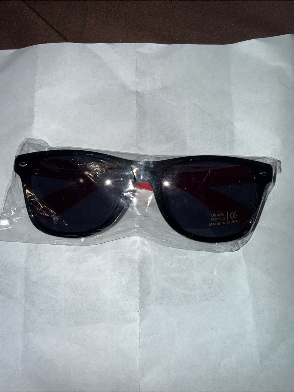 Panda Express sunglasses with red arms and white text reading 'PANDA EXPRESS'
